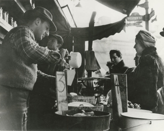 A Lower East Side pickle man serves customers. 