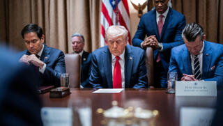 President Donald Trump prays at the first cabinet meeting of his second term at the White House in February, 2025. (Jabin Botsford/The Washington Post via Getty Images)