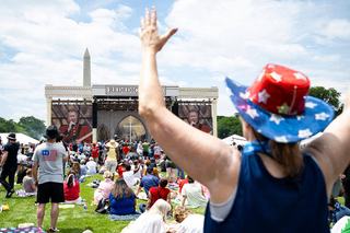 Attendees listen to a military band on stage during 'Rededicate 250: A National Jubilee of Prayer, Praise and Thanksgiving,' on the National Mall, on May 17.