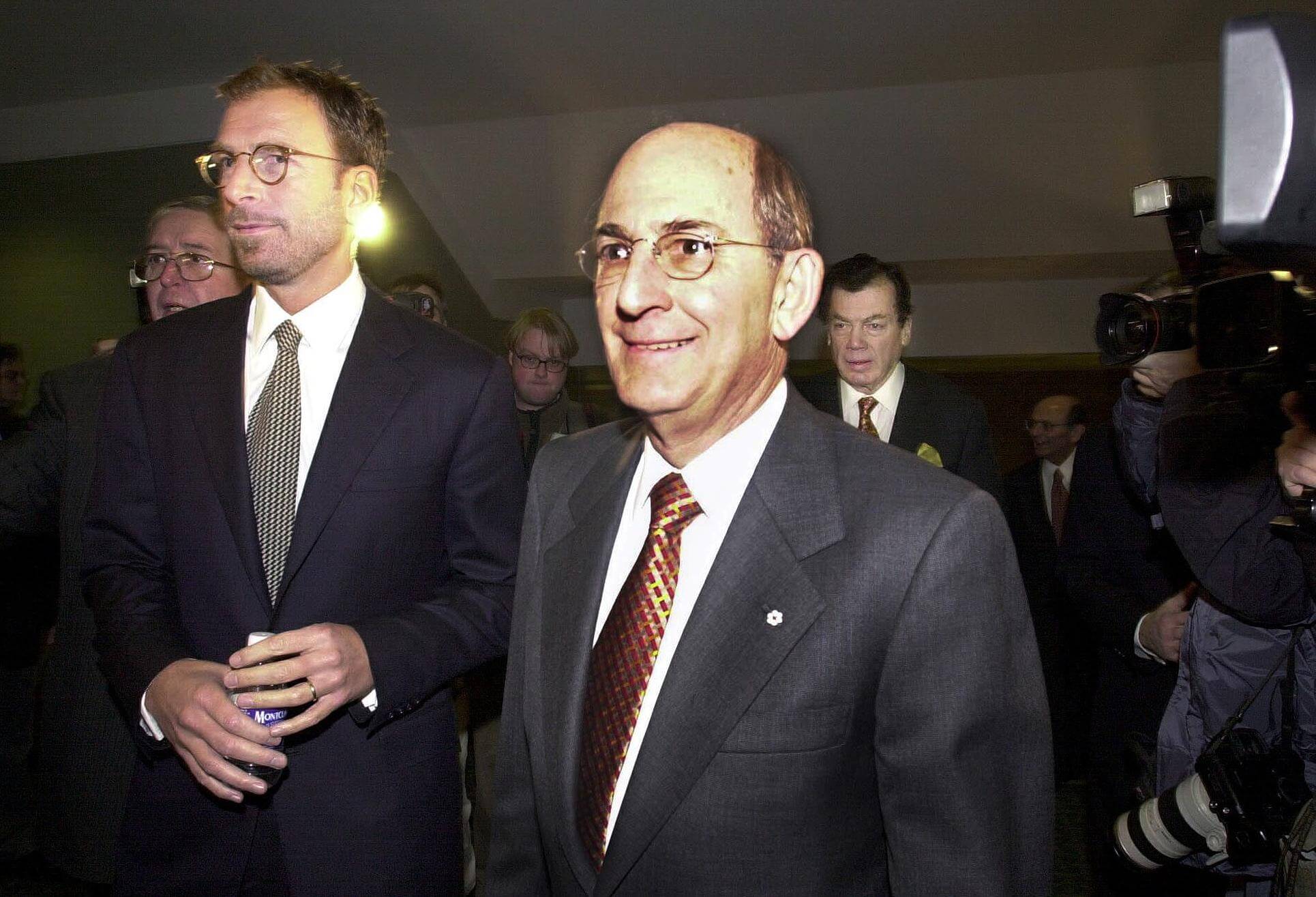 Charles Bronfman, center, arrives at Seagram's annual shareholders' meeting on December 5, 2000 in Montreal.