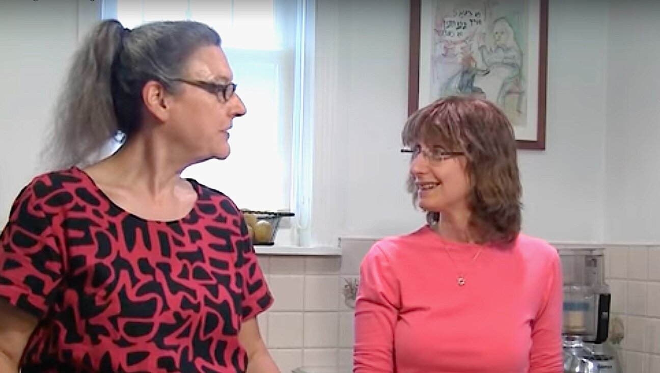 Eve Jochnowitz (left) and Rukhl Schaechter preparing the ginger candy 