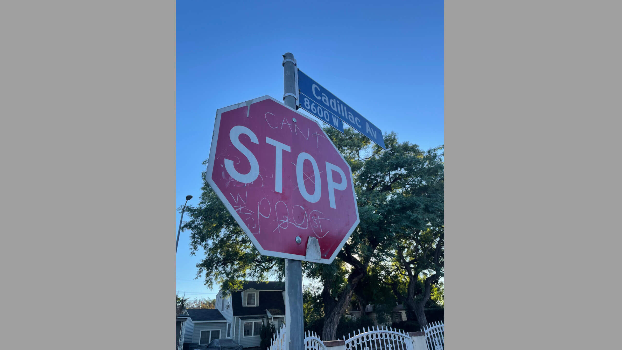 A stop sign in the Cadillac-Corning neighborhood, tagged with Playboy Gangster Crips graffiti.