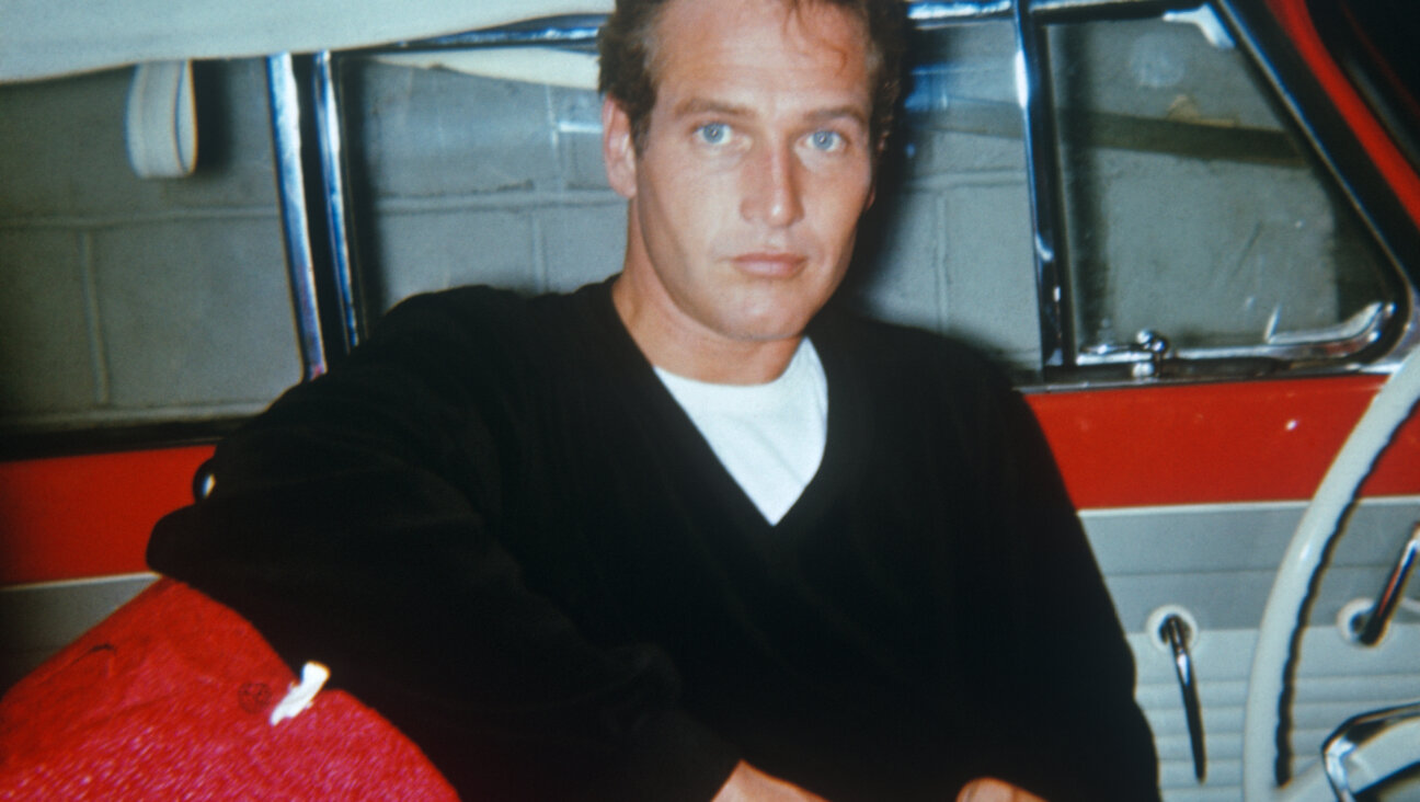 Paul Newman in the 1950's, sitting in a red car with white interior.  The photograph was  taken with a star flash camera.  The photographer was walking with his family and saw this unknown actor he recognized--after "The Young Philadelphians" was released. (Photo by Art Zelin/Getty Images)