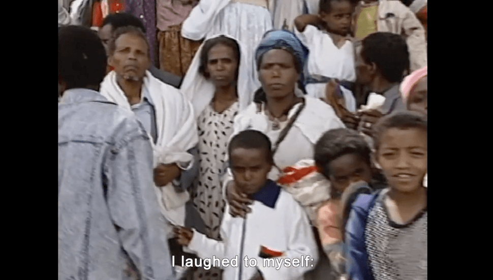 A still from “With No Land” shows archival footage of Beta Israel gathered before Operation Solomon.