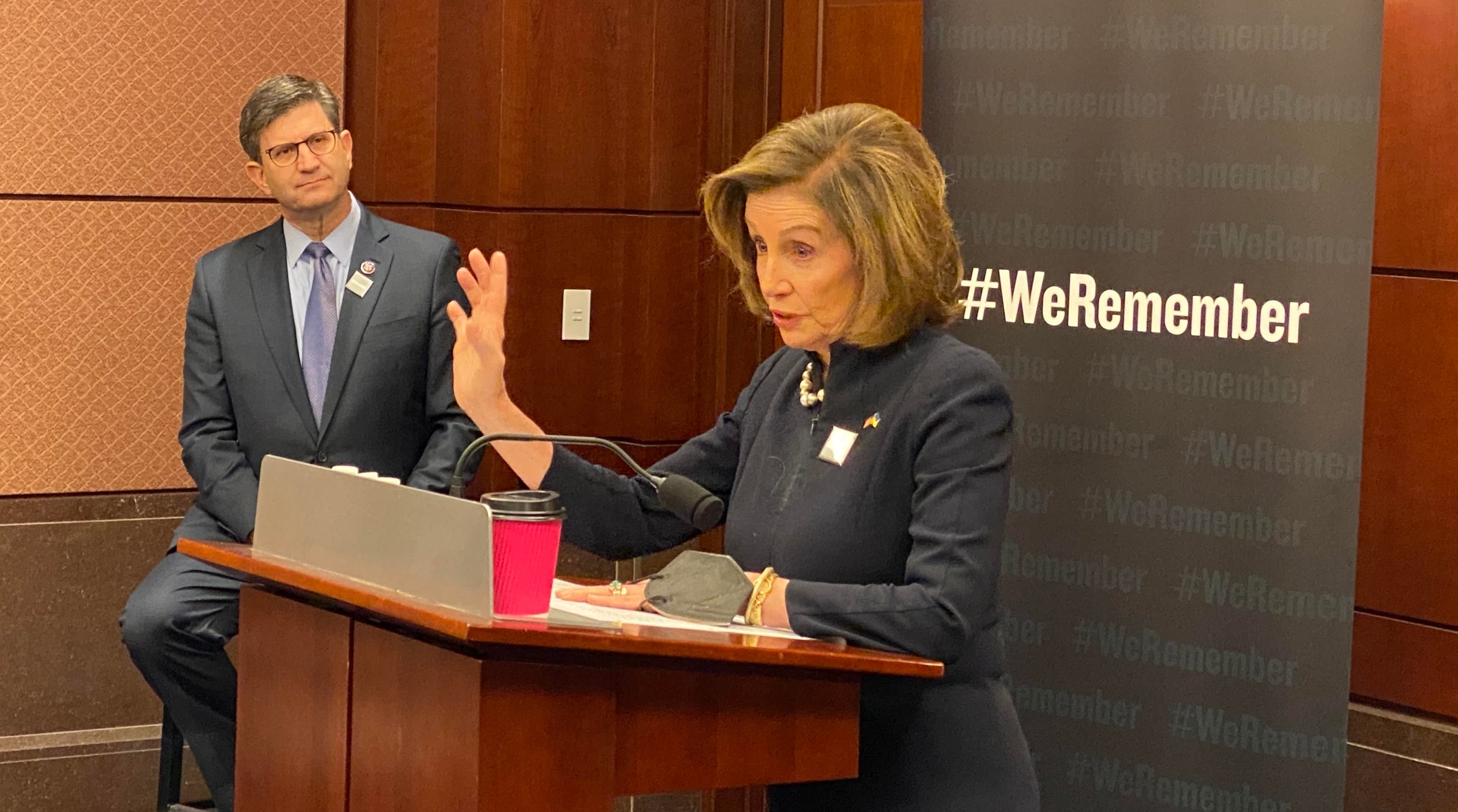 House Speaker Nancy Pelosi speaks while Rep. Brad Schneider looks on at a Yom Hashoah commemoration in the Capitol, April 27, 2022. (Office of Brad Schneider)