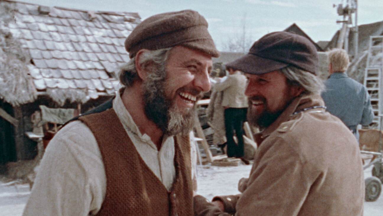Director Norman Jewison, right, and star Topol as Tevye on the set of the film version of “Fiddler on the Roof.” (Zeitgeist Films in association with Kino Lorber)