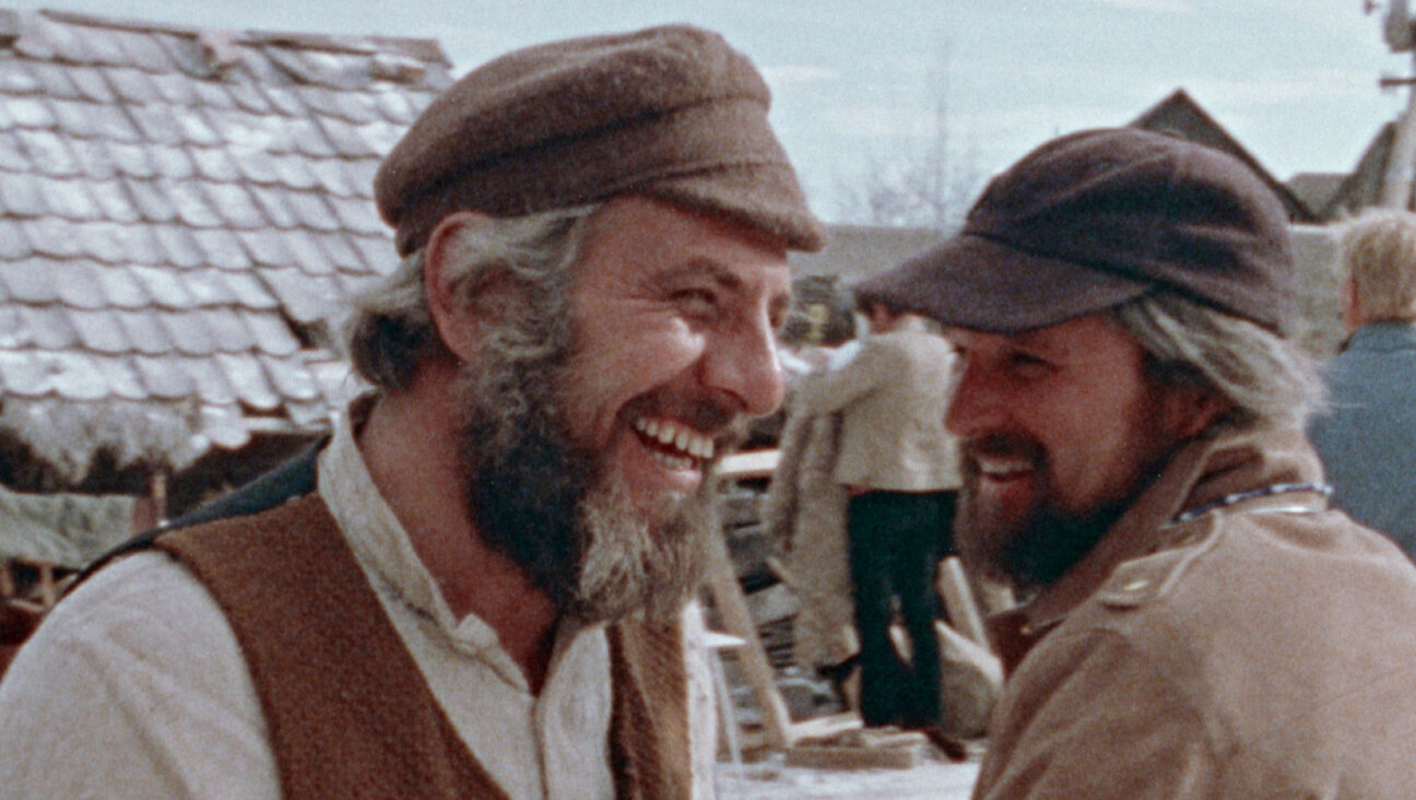 Director Norman Jewison, right, and star Topol as Tevye on the set of the film version of <i>Fiddler on the Roof.</i>
