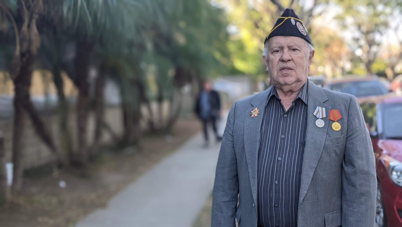 Boris Melamed, the president of the Los Angeles Association of Veterans of World War II, stands near his West Hollywood apartment. 