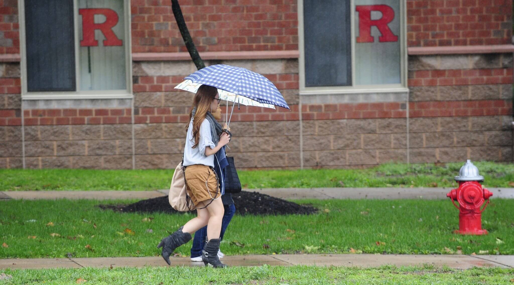 A student walks past the dormitory at Rutgers Univeristy in New Brunswick, New Jersey on October 1, 2010.
