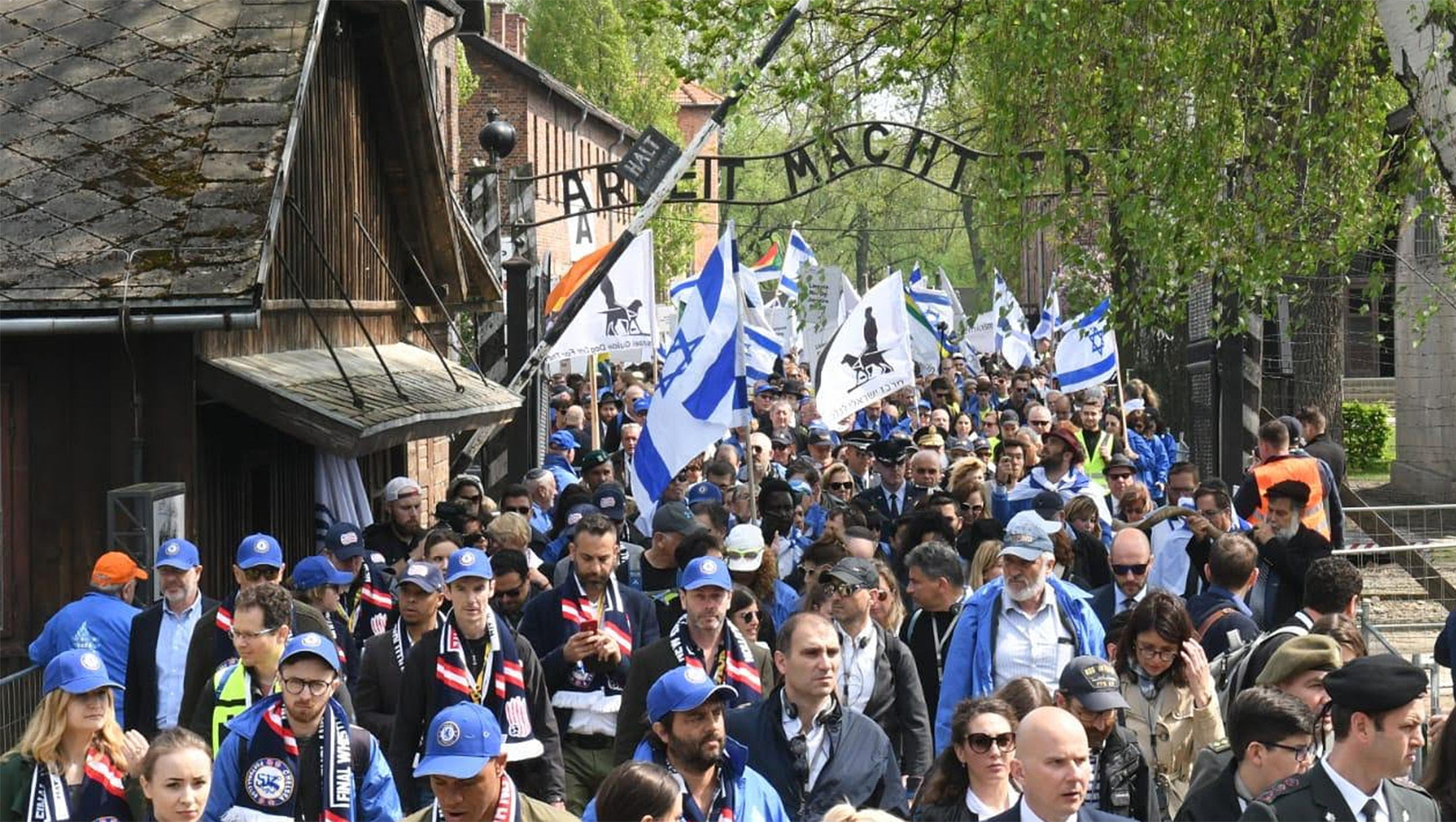 Participants of the March of the Living exit a gate in the former Nazi camp Auschwitz in Poland, May 2, 2019. (Courtesy of the International March of the Living)