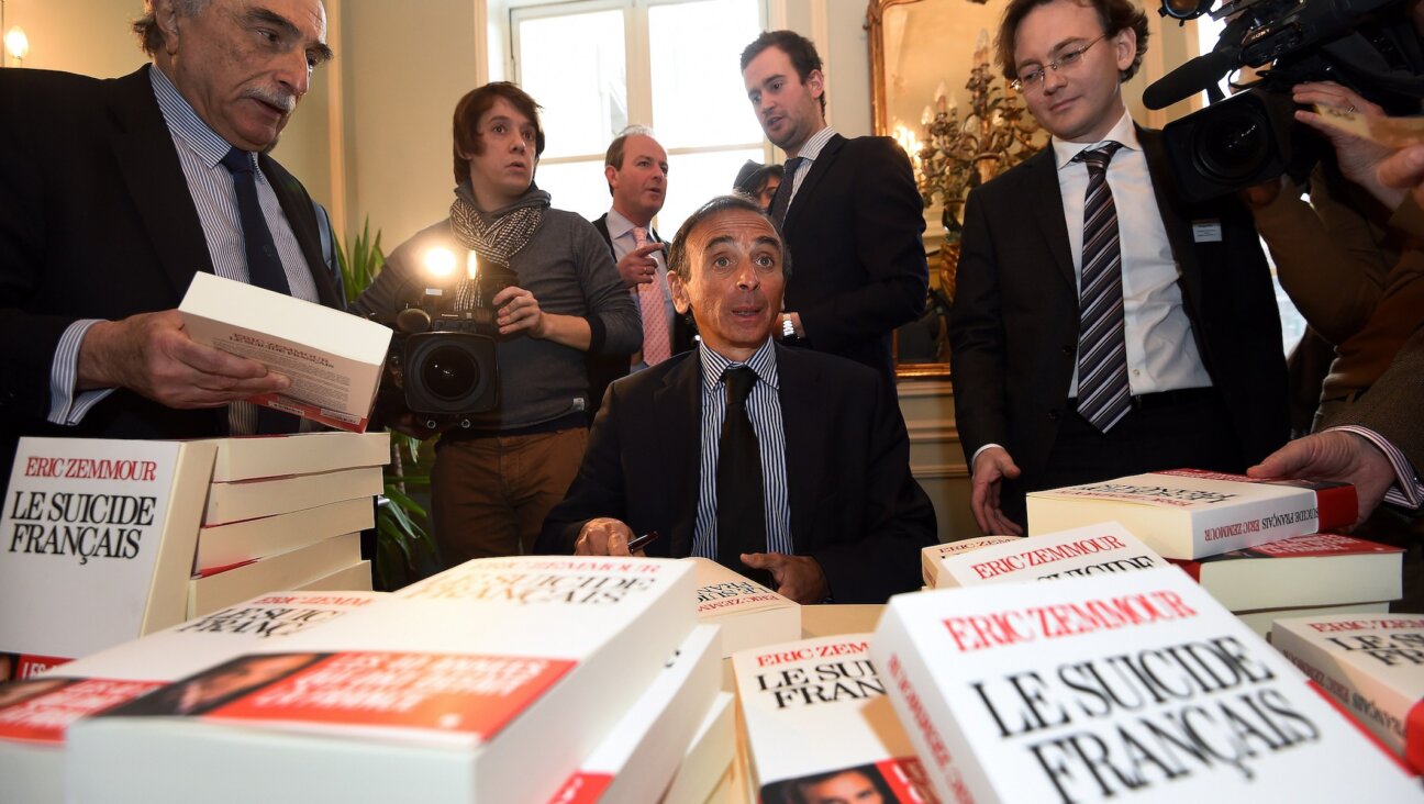 Eric Zemmour signs copies of his book "The French Suicide" at the Cercle de Lorraine-Club Van Lotharingen in Brussels, Belgium, Jan. 6, 2015. 