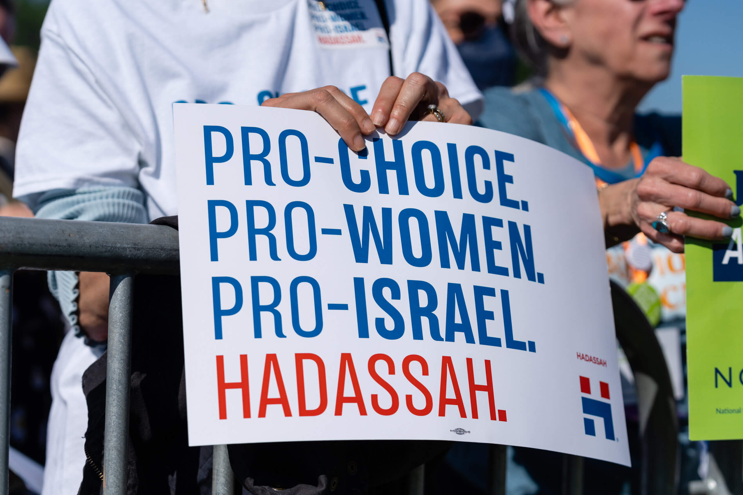 A sign reads "Pro-Choice, Pro-Women, Pro-Israel."