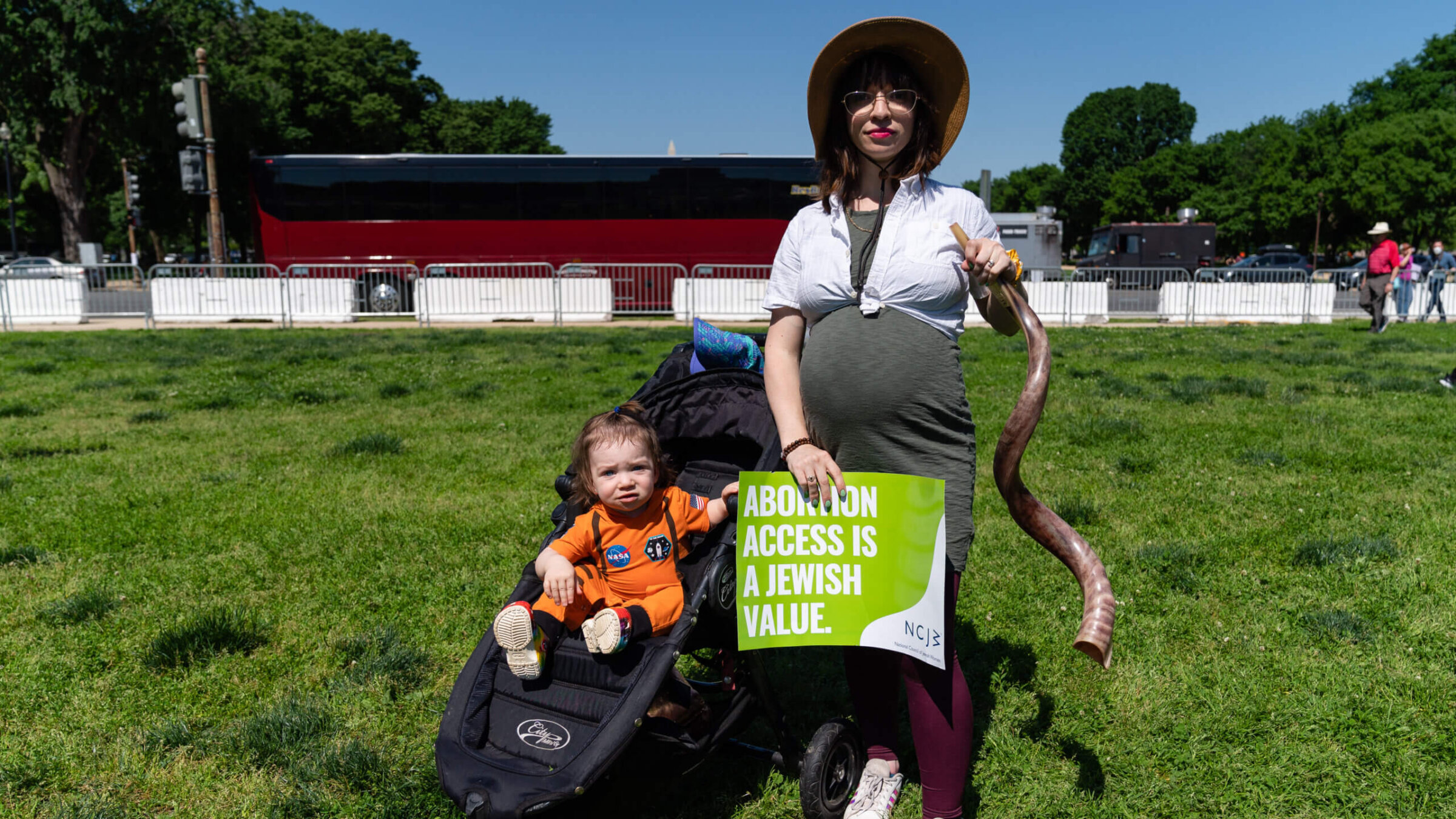 Amanda Herring, 32, and her child Abraham, 1, of Washington, D.C., pose for a portrait during the Jewish Rally for Abortion Justice, May 17. 2022.
