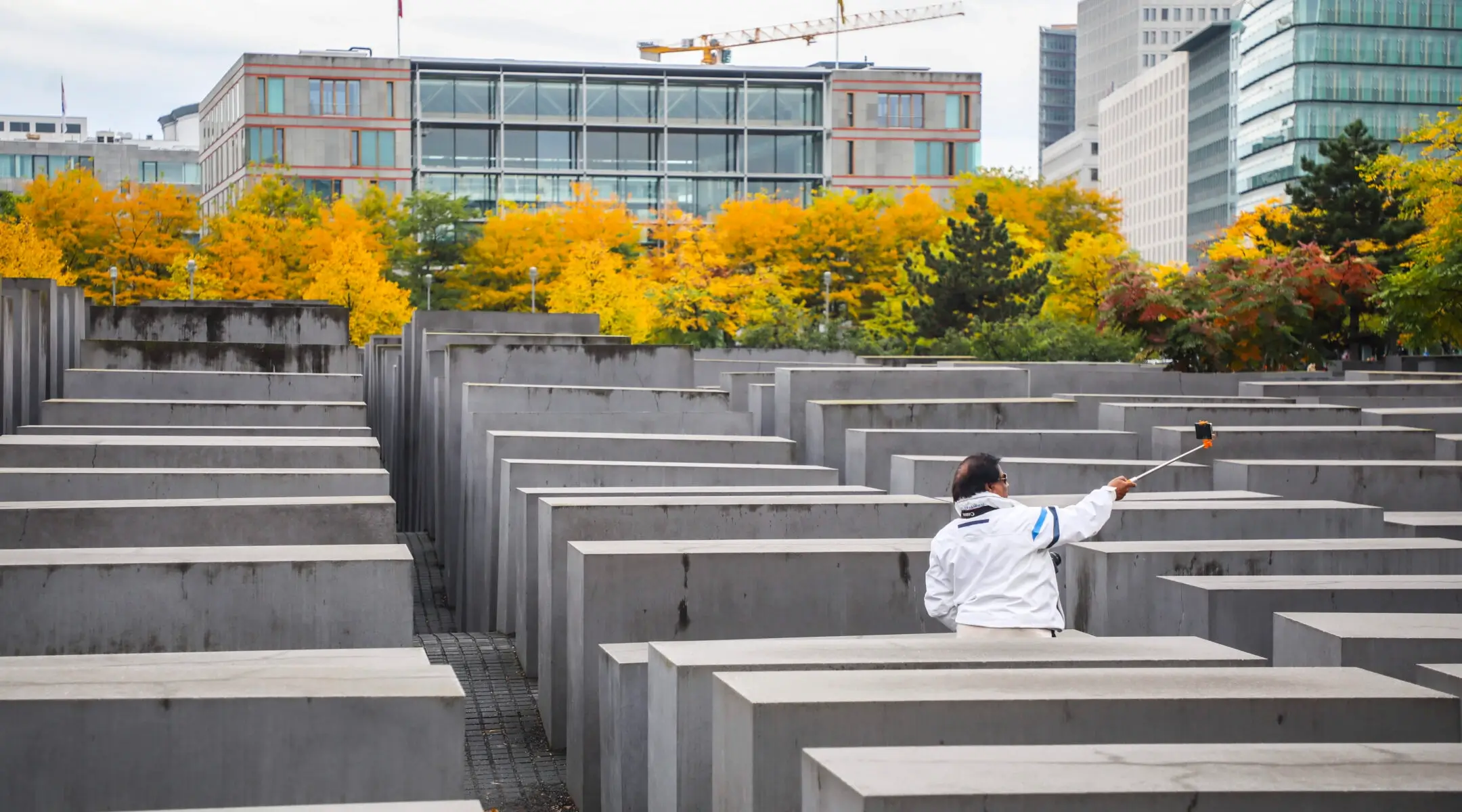 A tourist takes a selfie inside the Memorial To The Murdered Jews Of Europe in Berlin, Sept. 25, 2019.
