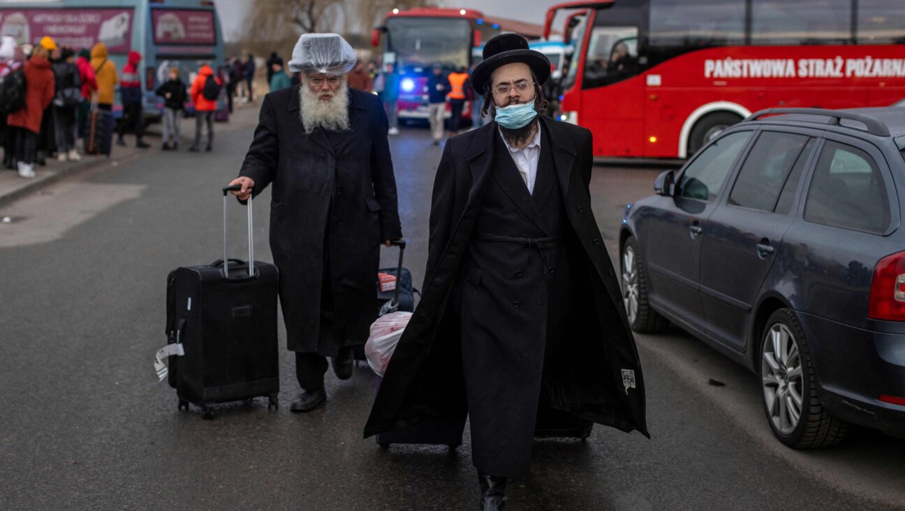 Two Orthodox Jews arrive at the Medyka pedestrian border crossing in eastern Poland on February 25, 2022.