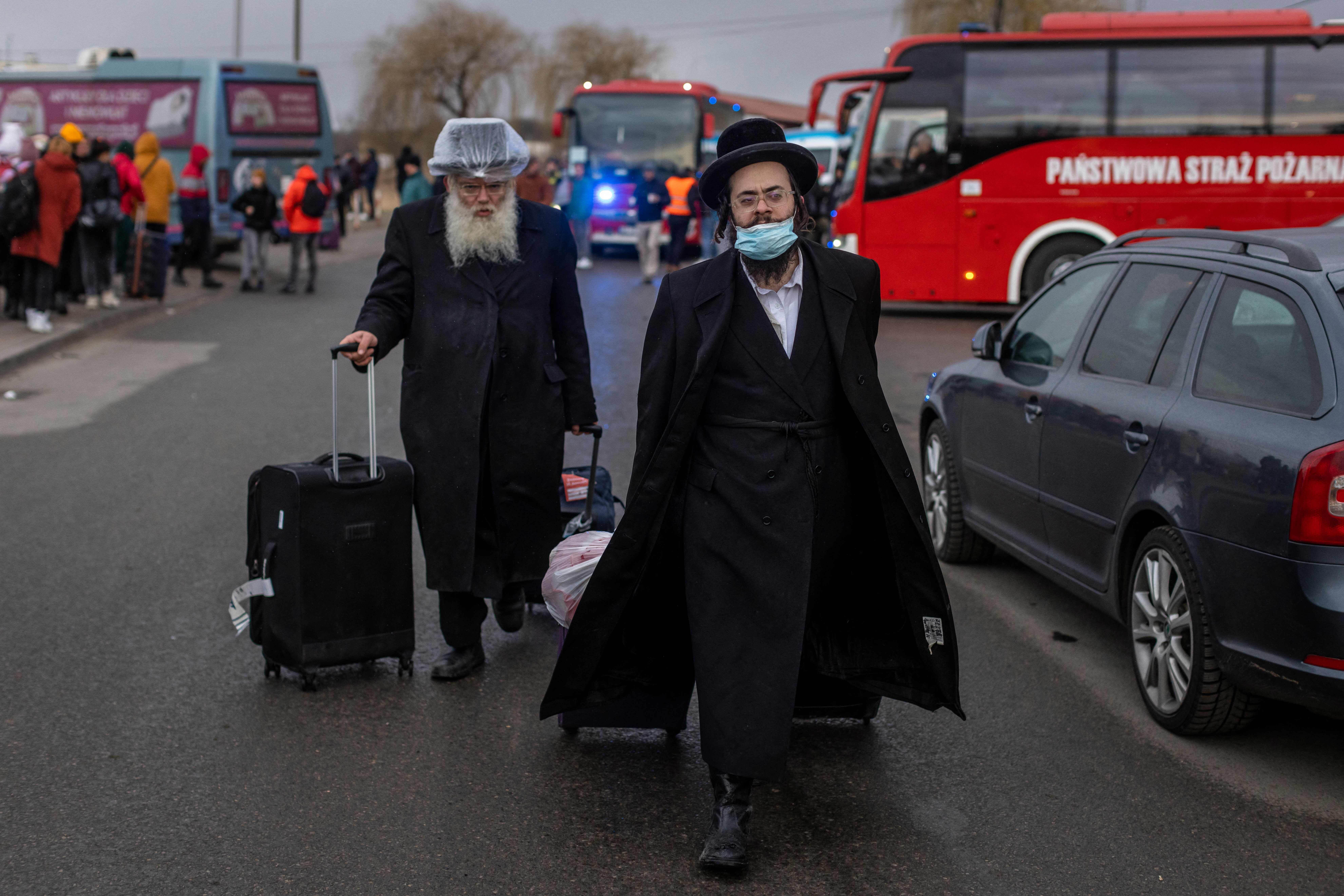 Two Orthodox Jews arrive at the Medyka pedestrian border crossing in eastern Poland on February 25, 2022.