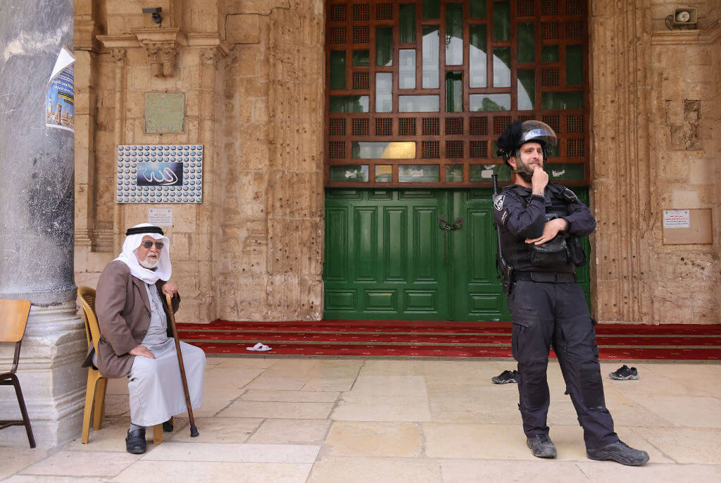 An Israeli policeman stands guard on May 5, 2022 during a visit by a group of Jewish people at the al-Aqsa mosque compound.