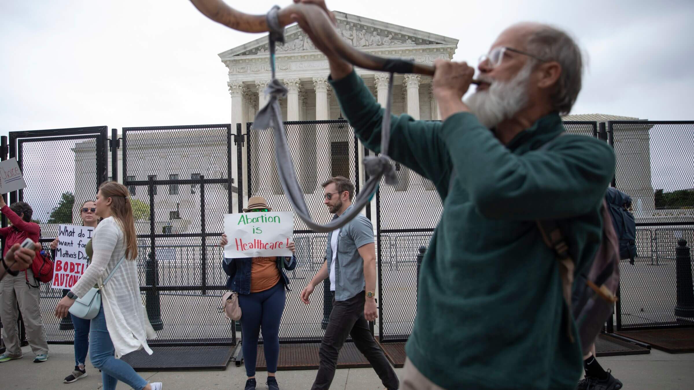 An anti-abortion demonstrator blows a shofar outside the U.S. Supreme Court on May 5, 2022 in Washington, DC. 