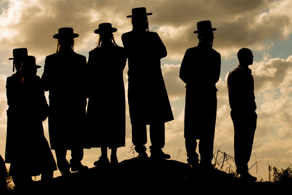 Ultra-Orthodox Jewish men gather in Haifa.