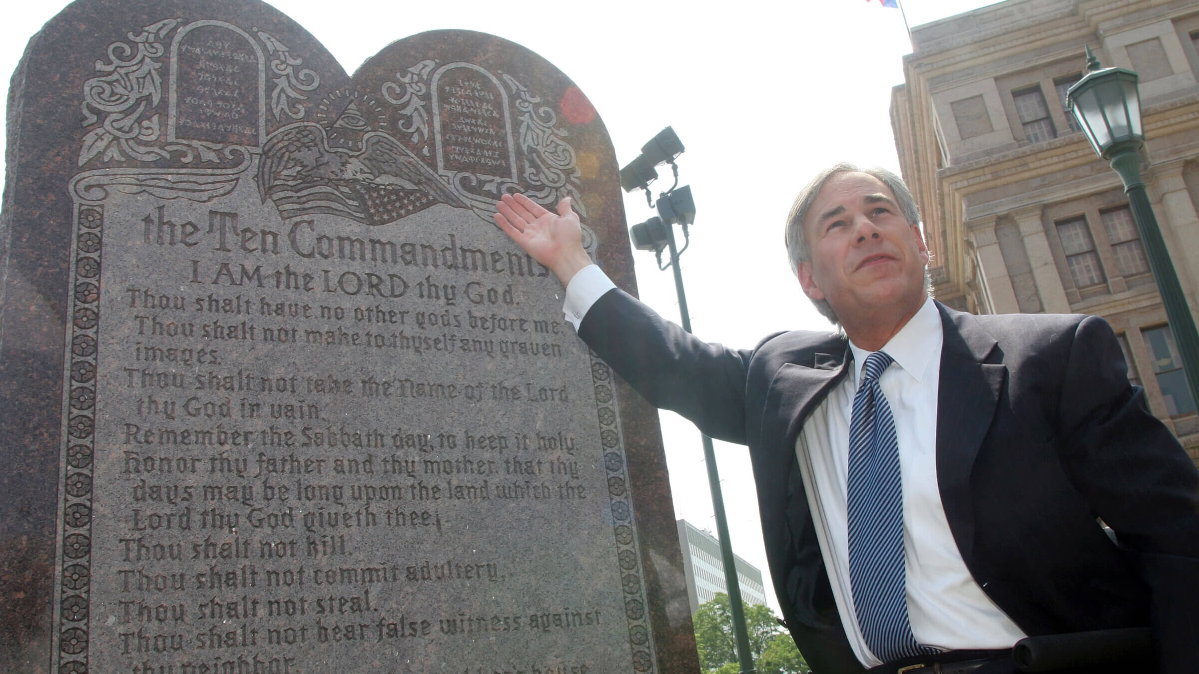 Texas Attorney General Greg Abbott celebrates the U.S. Supreme Court decision that allows a Ten Commandments monument to stand outside the Texas State Capitol, June 27, 2005. His party ascribes to a vision of the country as an ethno-nationalist Christian theocracy.