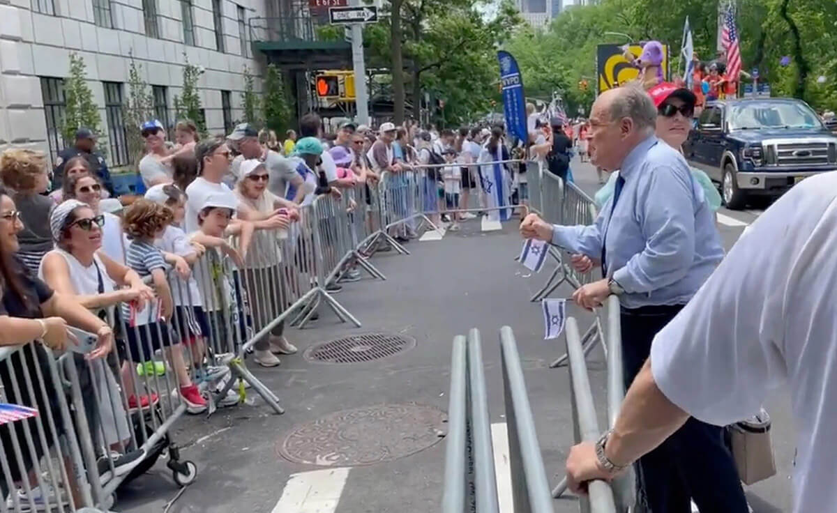 Former New York City Mayor Rudy Giuliani shouting at an onlooker at the annual Celebrate Israel parade on May 22, 2022