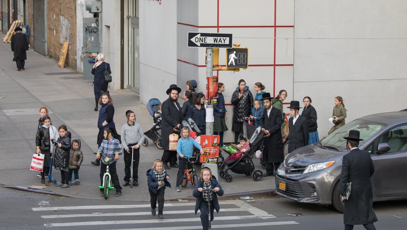 Families walk on the streets of Williamsburg May 12. (Avi Kaye)