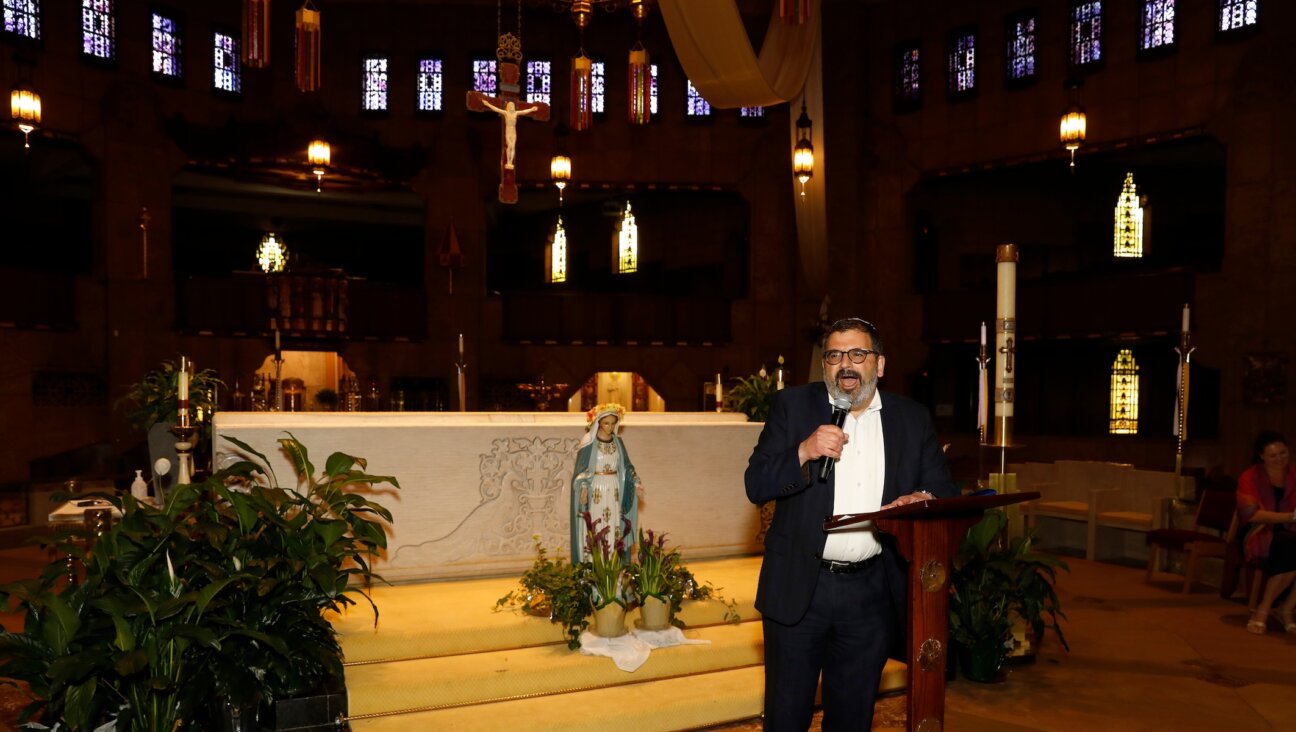 Rabbi Asher Lopatin, executive director of the Detroit JCRC/AJC, speaks from the old dais of Father Charles Coughlin at the National Shrine of the Little Flower Catholic church in Royal Oak, Mich., May 31, 2022. Lopatin had helped organize an event at the church discussing “the Jewish-Catholic Relationship.” Shrine’s founder, Father Coughlin, broadcasted an antisemitic radio show during the Great Depression. (Jeff Kowalsky)