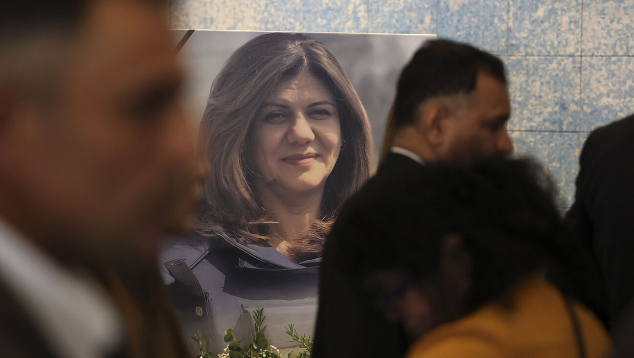 Mourners attend a memorial ceremony for Shireen Abu Akleh, to mark the 40th day of the killing of the Al Jazeera journalist, in the West Bank city of Ramallah, June 19, 2022. 