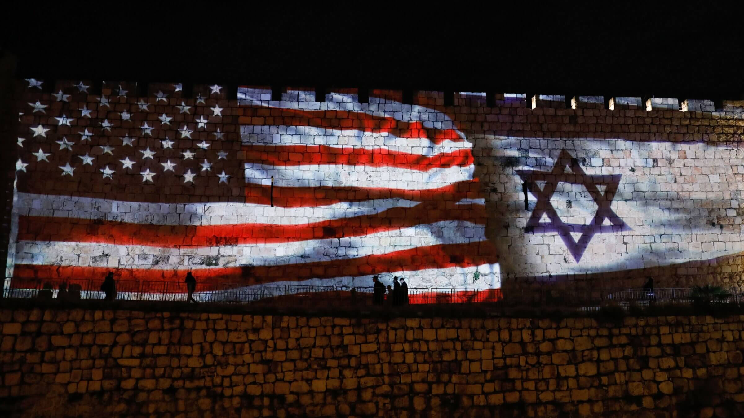 The Israeli and United States flags are projected on the walls of the ramparts of Jerusalem's Old City, to celebrate close ties between the two nations, on February 11, 2020