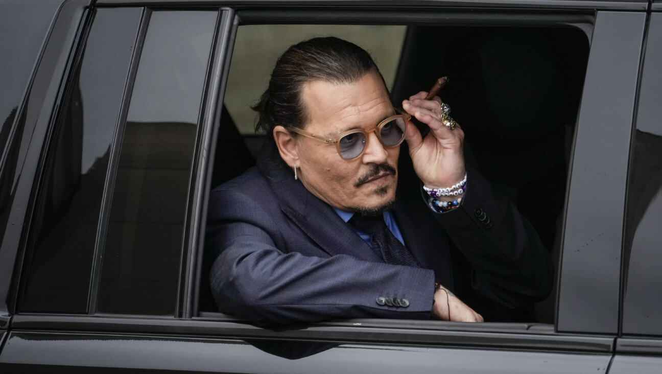 Actor Johnny Depp sits in his vehicle as he departs the Fairfax County Courthouse on May 27, 2022 in Fairfax, Virginia.