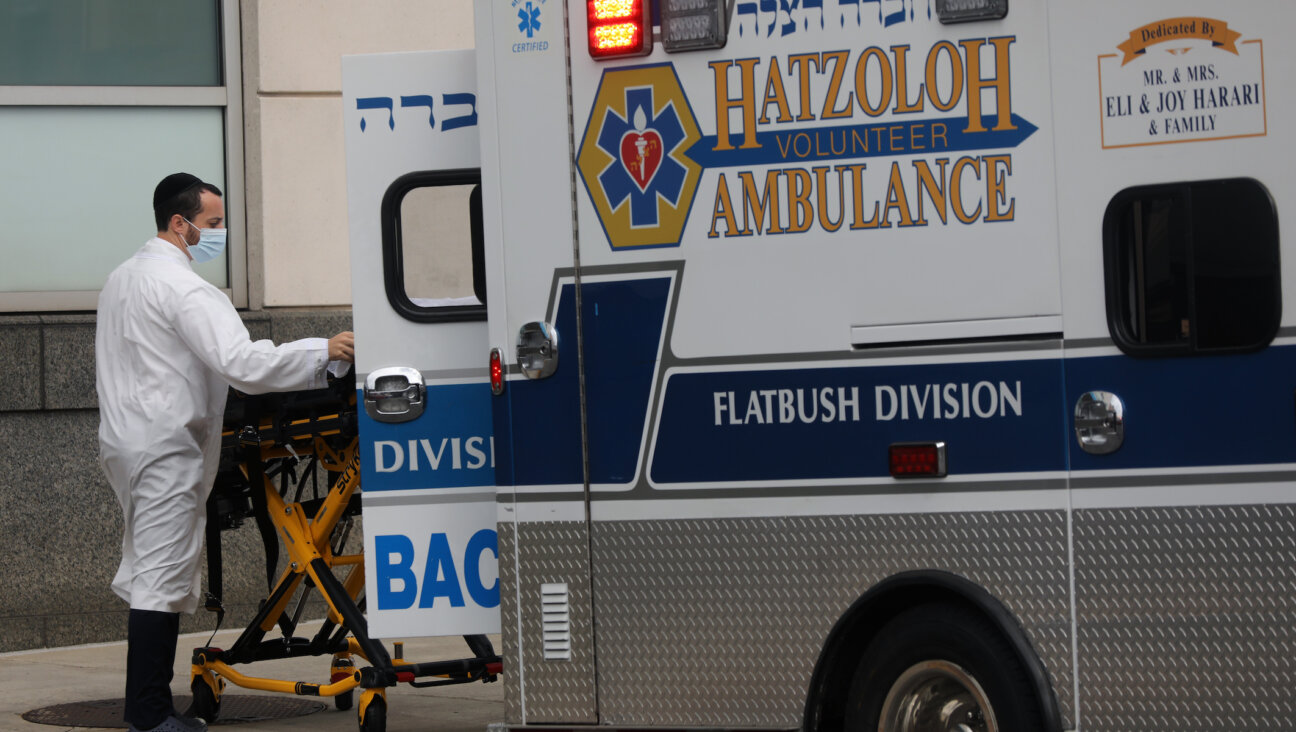 Hatzalah workers bring patients to Maimonides Medical Center in Borough Park, Brooklyn, in late 2020. (Spencer Platt/Getty Images)