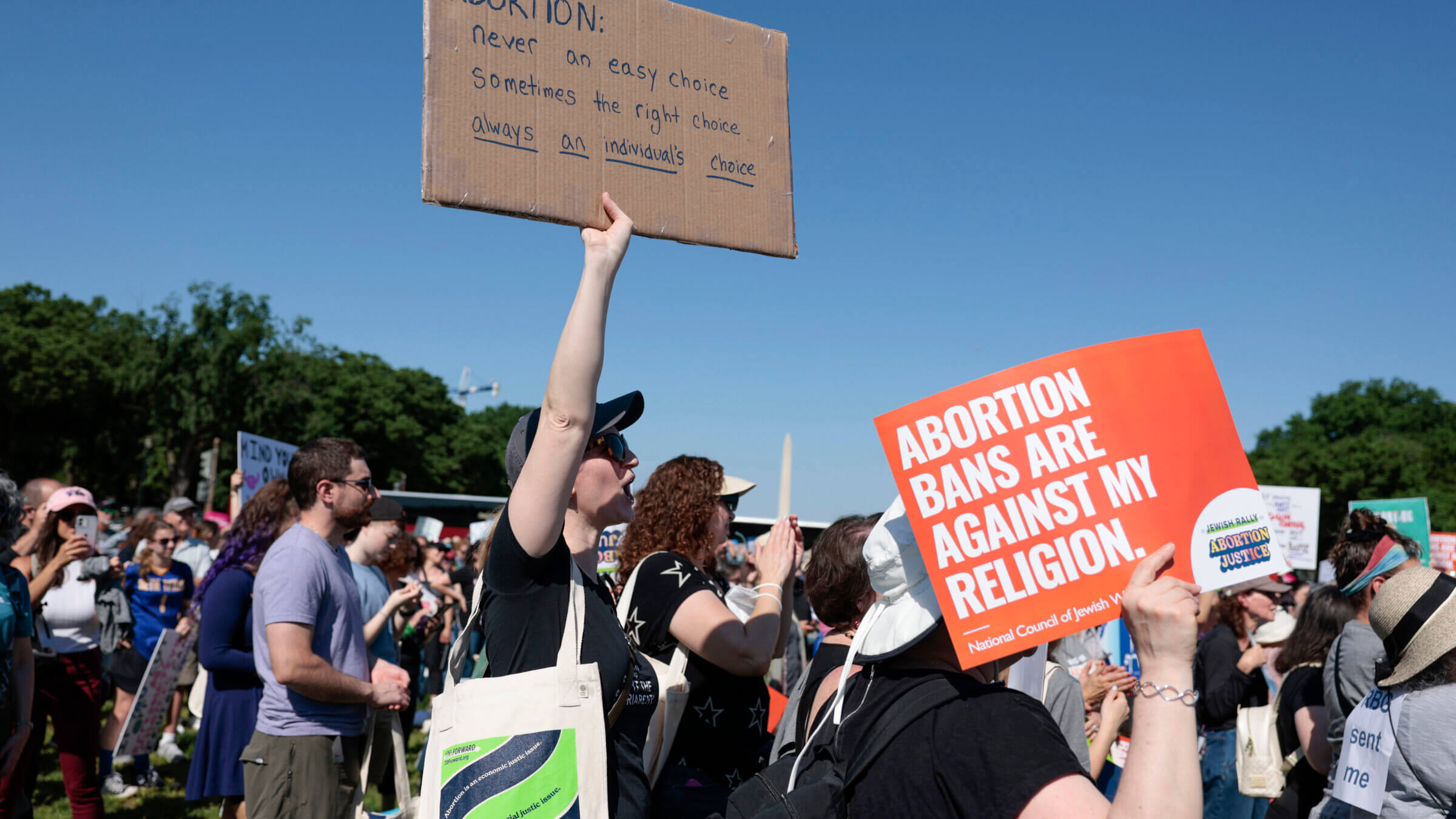 A protester carries a sign as they attend the “Jewish Rally for Abortion Justice” rally in May.