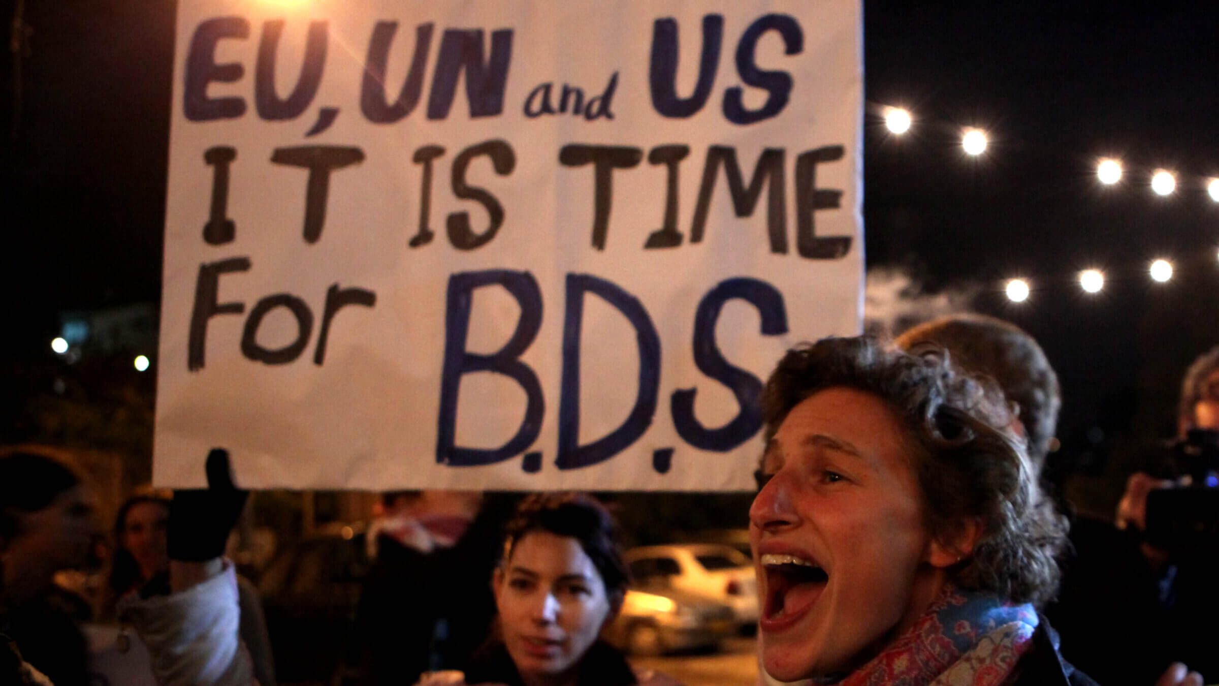 Left-wing Israeli and foreign peace activists join Palestinians in a protest in the Arab east Jerusalem neighborhood of Sheikh Jarrah in 2009. The BDS Movement criticized the Boston-based Mapping Project this week, after the anonymous collective's database of entities allegedly tied to Israel, including dozens of Jewish organizations, came under heavy fire and drew the attention of law enforcement.