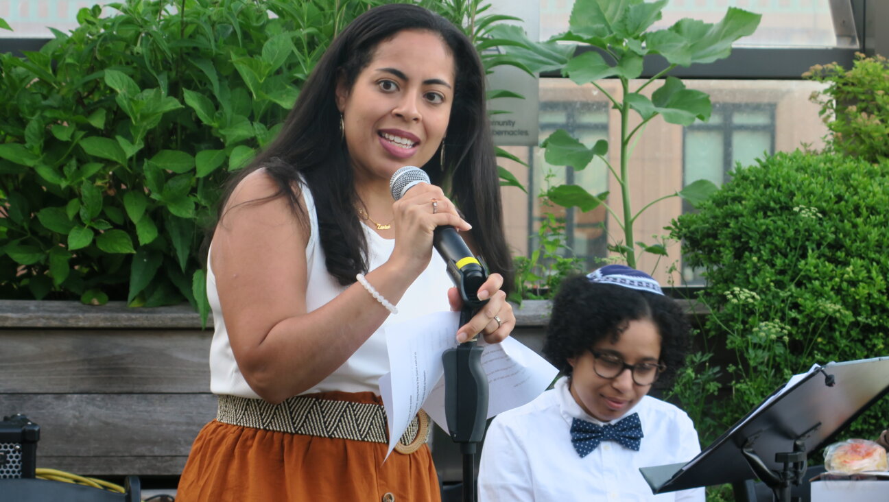 Yanira Quinones, who came with her family from Westchester, recites a Juneteenth poem at the Be'chol Lashon Juneteenth Shabbat in New York City.