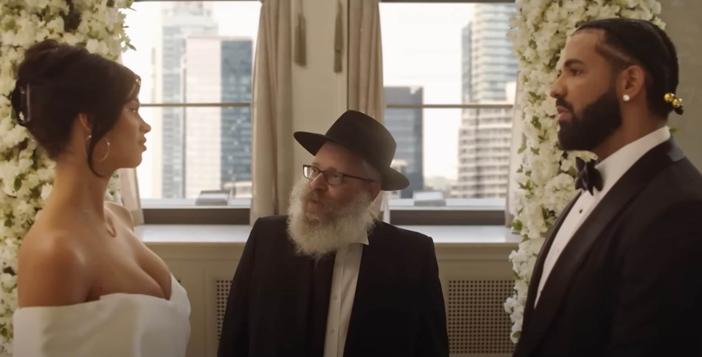 In this screenshot from Drake's "Falling Back" video, Ari Sitnik plays a rabbi who performs Drake's wedding to the first of 23 brides.