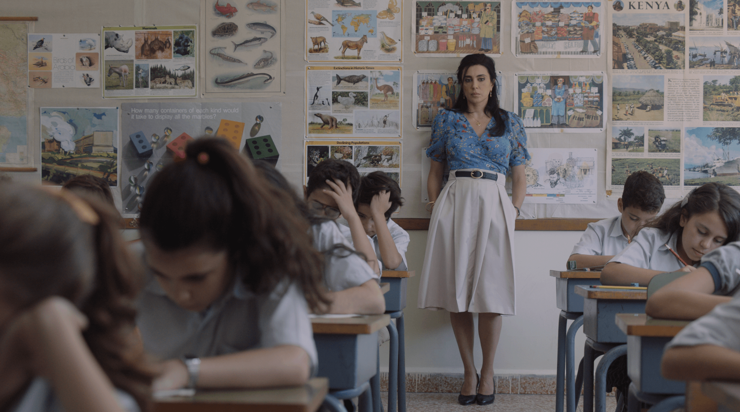 A still from "1982" shows Yasmine (Nadine Labaki) proctoring an exam.