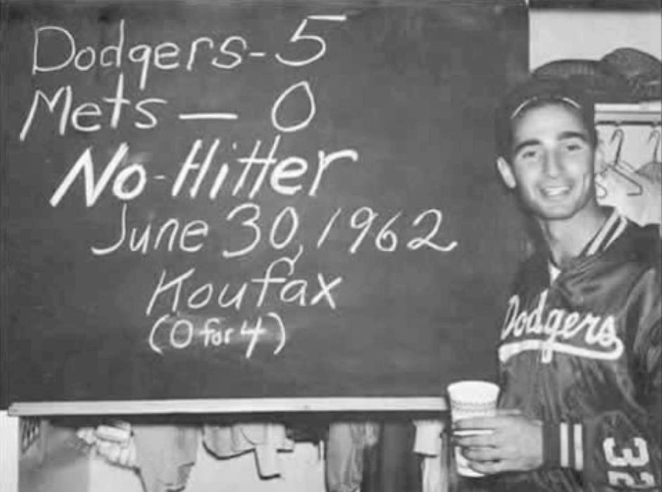 Sandy Koufax in front of a chalkboard summary of his first no-hitter on June 30, 1962.
