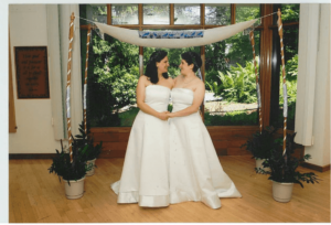 Elizabeth Perlman Bodian, left, and Dena Bodian in their wedding gowns.