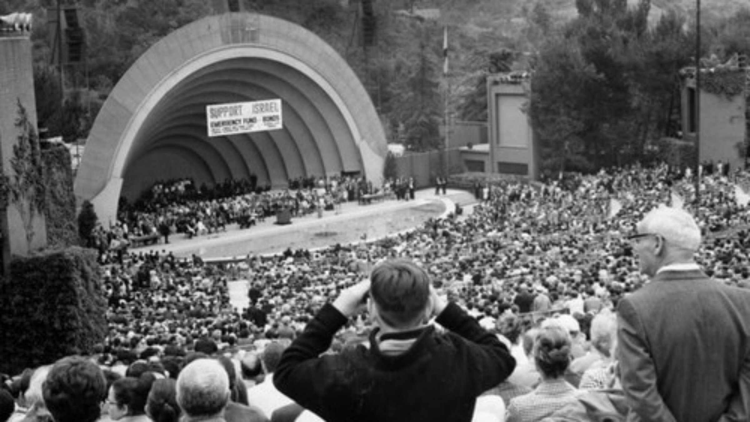 The Hollywood Bowl overflowed with people attending the 'Rally for the survival of Israel.' Gov. Ronald Reagan speaks from the podium. Celebrities present included Frank Sinatra, Danny Kaye and Ernest Borgnine.