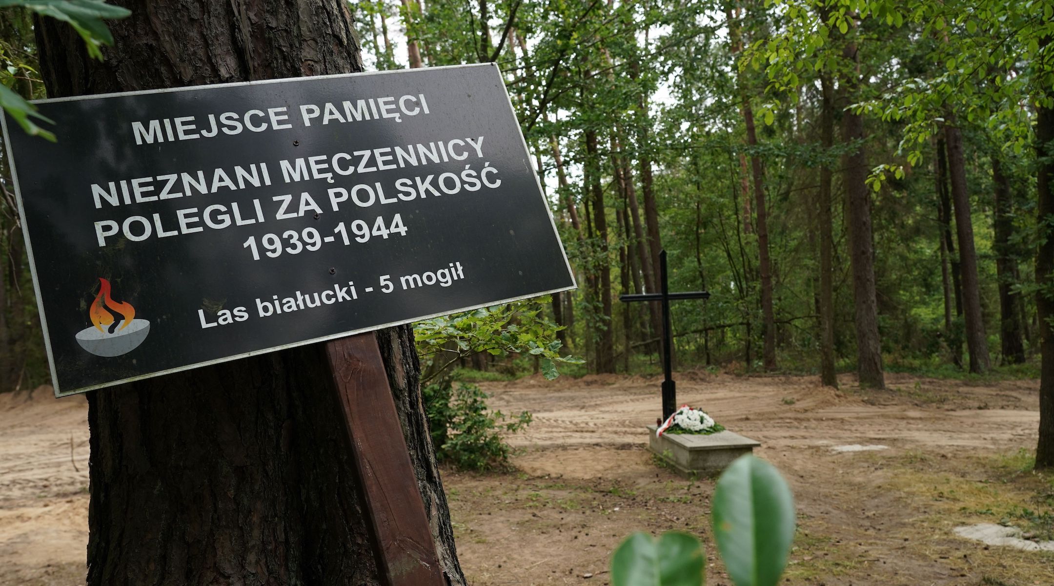 A symbolic grave outside the town of Działdowo, Poland, where a mass grave of about 8,000 Geman Nazi victims from the nearby Soldau concentration camp was unearthed at the beginning of July 2022. (Janek Skarzynski/AFP via Getty Images)