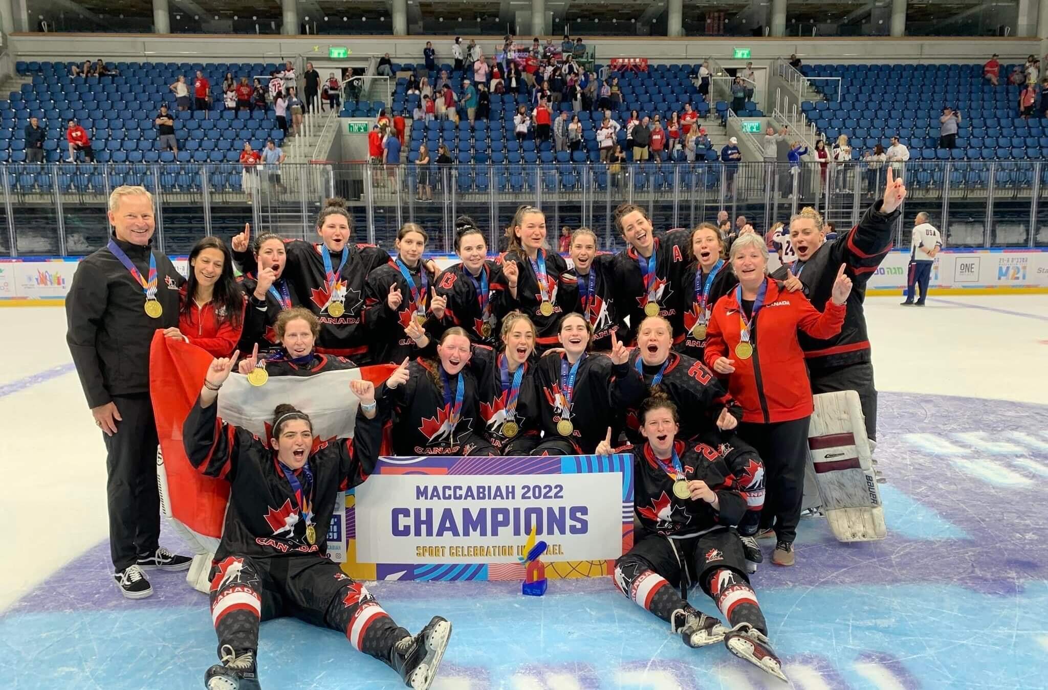 The Canadian team celebrates after winning the gold medal by defeating the U.S., 6-2, in Friday's championship game in the debut of women's hockey at the Maccabiah Games. Coach Peter Smith stands left; Melissa Wronzberg, Canada’s captain, reclines, bottom right. 