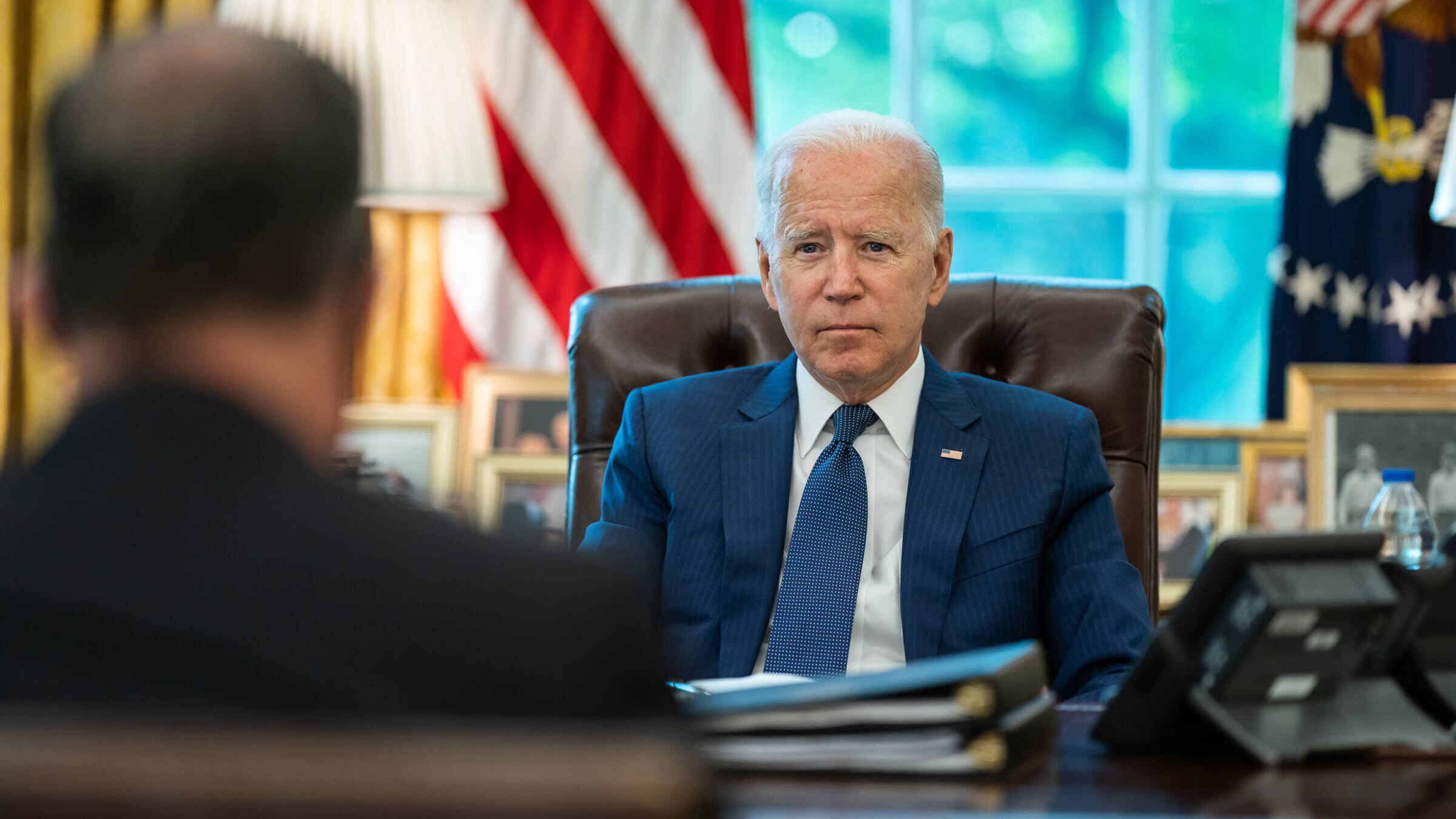 President Joe Biden meets with White House staff in the Oval Office, Thursday, Aug. 26, 2021, to prepare for a meeting with Israeli Prime Minister Naftali Bennett on August 26, 2021. 