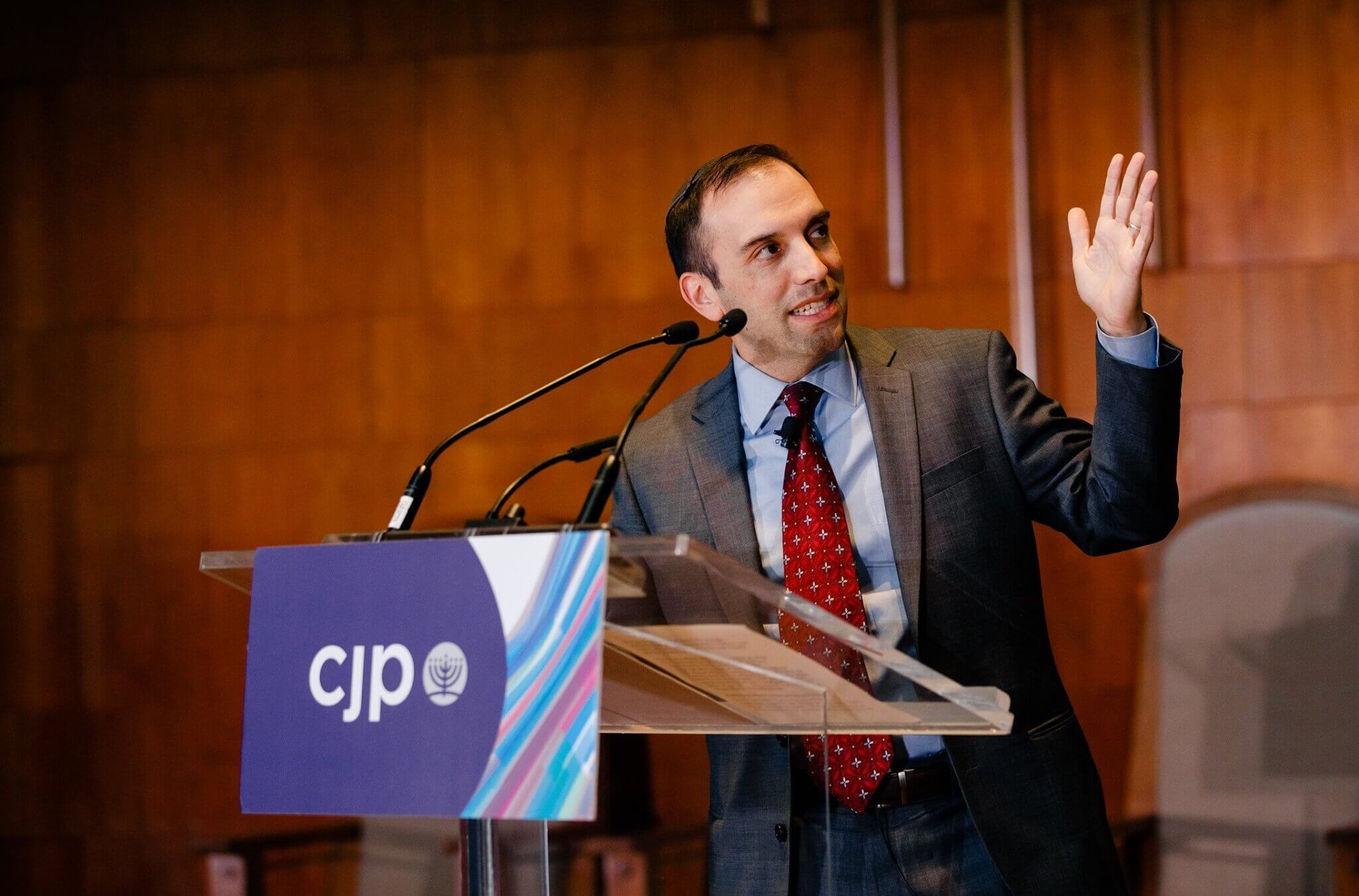 Marc Baker, the chief executive of Boston’s Jewish federation, speaks at a 2019 event. Baker has faced several lawsuits from employees who claim officials at the the Combined Jewish Philanthropies illegally retaliated against them.