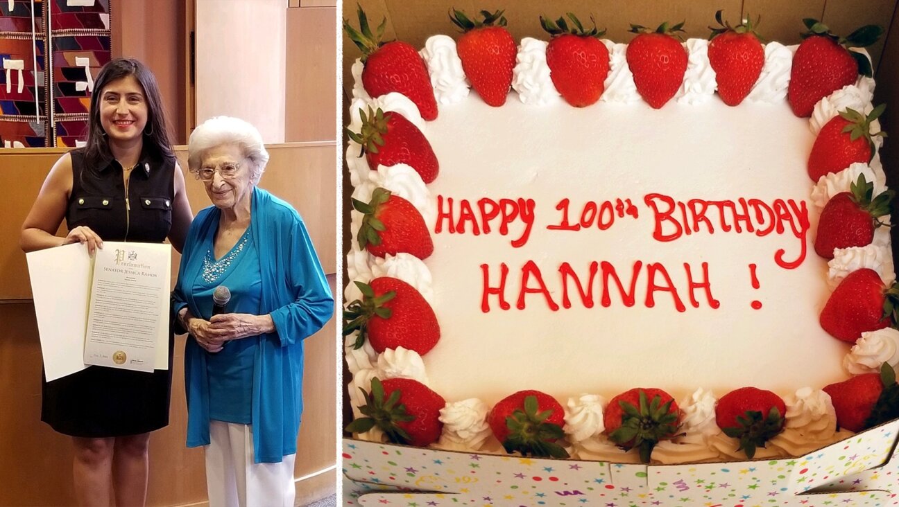 Hannah Deutch, a Holocaust survivor who turned 100 on July 3rd, celebrated her 100th birthday at a kiddush following Shabbat services at the Jewish Center of Jackson Heights, July 9, 2022. State Senator Jessica Ramos holds a proclamation in Deutch’s honor. (Lenore Skenazy)