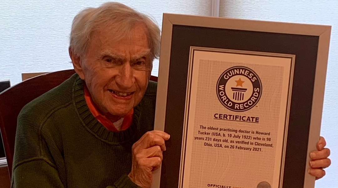 Dr. Howard Tucker holds the Guiness World Records certificate recognizing him as the oldest active physician in the United States. (Courtesy of Dr. Howard Tucker)