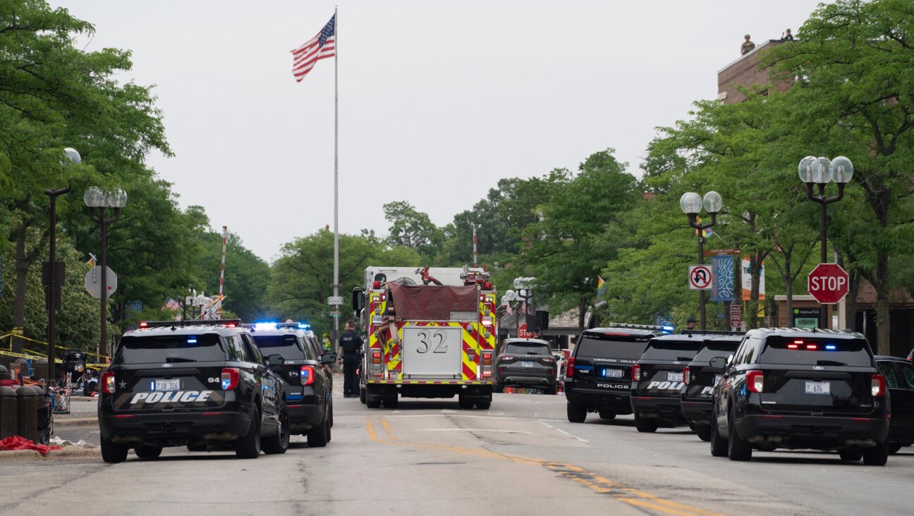 First responders and police force are seen at the scene of the shooting at a July 4 parade in Highland Park, Ill., July 4, 2022. (Youngrae Kim/AFP via Getty Images)