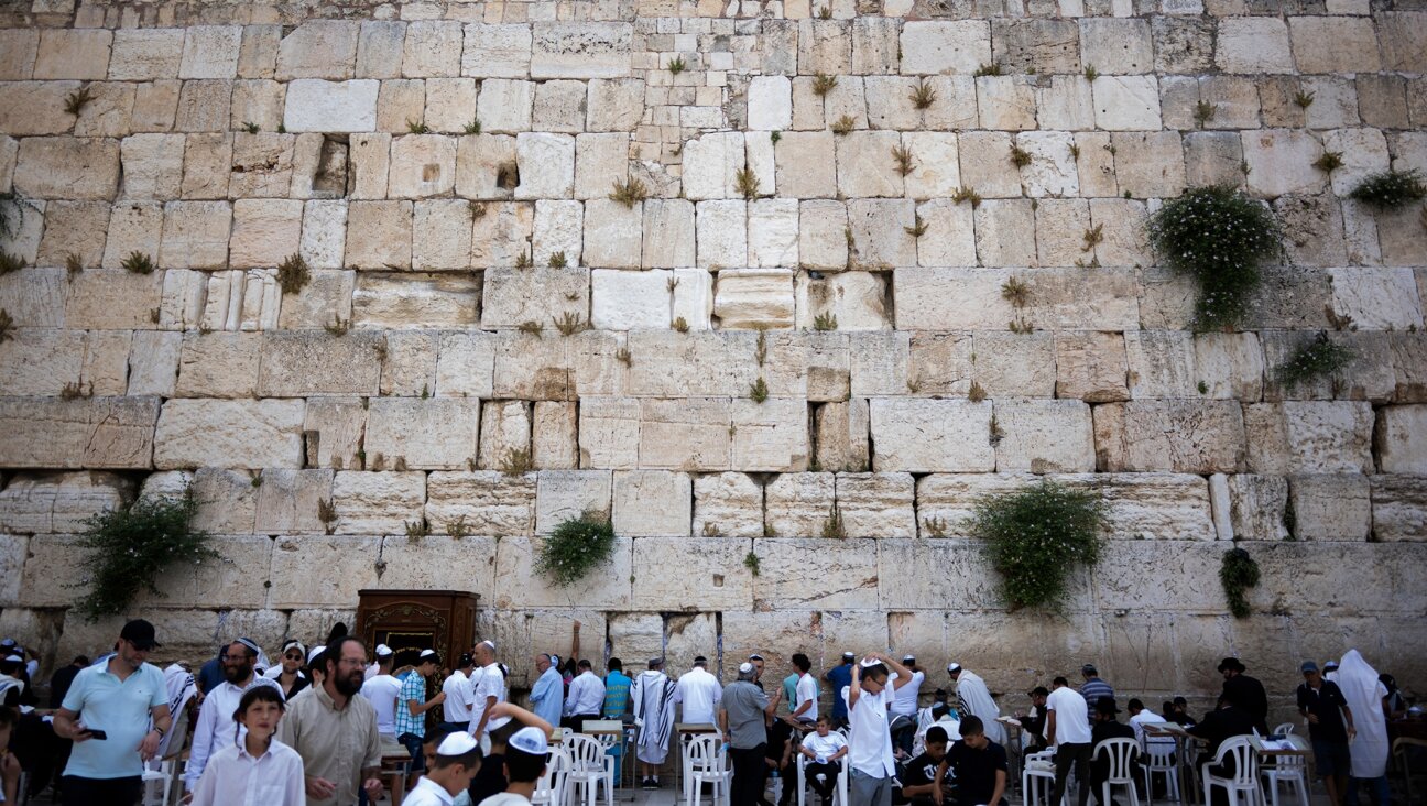 Jewish worshipers pray at the Western Wall in the Old City of Jerusalem, June 13, 2022. 