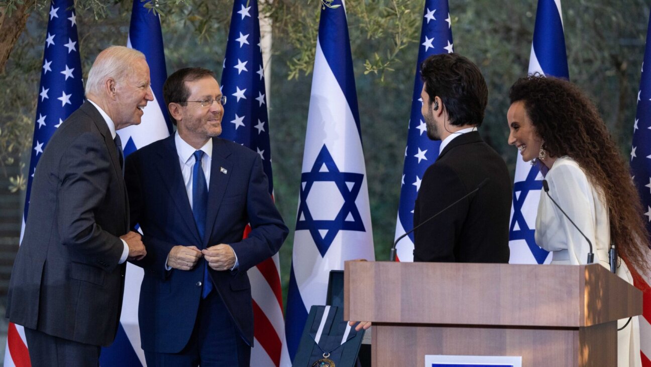 US president Joe Biden and Israeli president Isaac Herzog speak with Israeli singers Yuval Dayan and Ran Dankner during a ceremony at the President’s Residence in Jerusalem, July 14, 2022. (Yonatan Sindel/Flash90)
