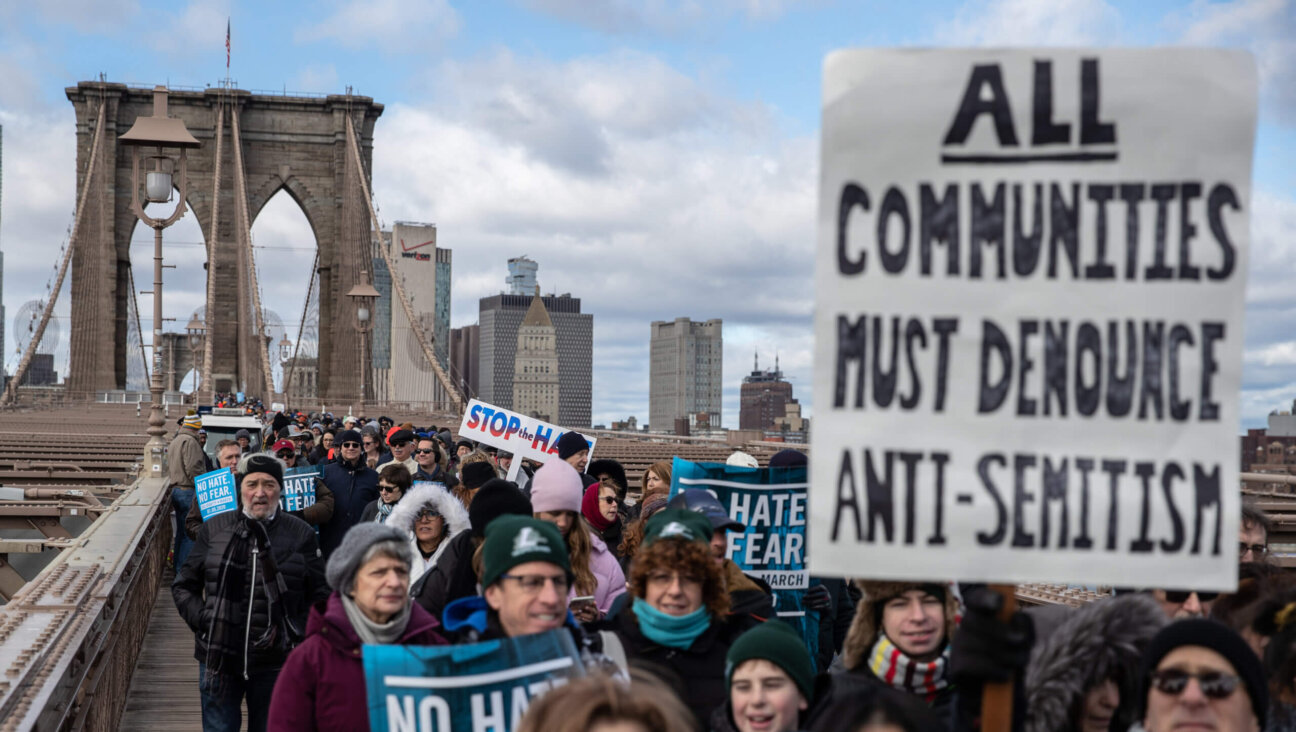 People participate in a Jewish solidarity march across the Brooklyn Bridge on January 5, 2020.