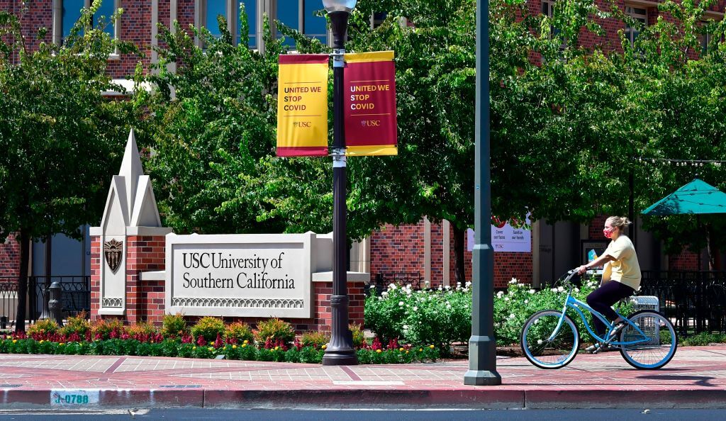 A cyclist rides her bike at the University of Southern California in 2020.